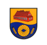 Wappen mit goldenem Hintergrund: oben ein rotes Gebäude mit Satteldach, unten ein blauer Bereich mit goldener Spirale und zwei goldenen Ähren.