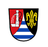 Gespaltenes Wappen: links roter Grund mit silbernem Brunnen, unten silber-blau gestreifte Spitze; rechts schwarzer Grund mit goldener Lilie.